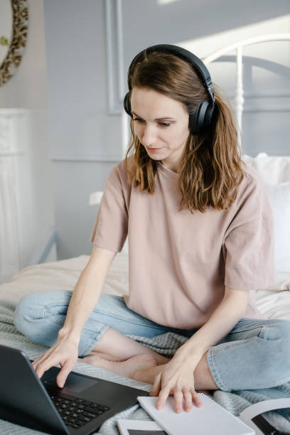 istock woman working on laptop remotely from home 1304514378