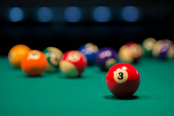 American pool balls on a pool table with number three in focus Red ball number 3 is focused and the rest of the balls are out of focus pool break stock pictures, royalty-free photos & images