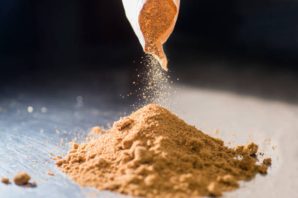 istock Yellow powder crumbles into a heap. Bakery concept 1304516902