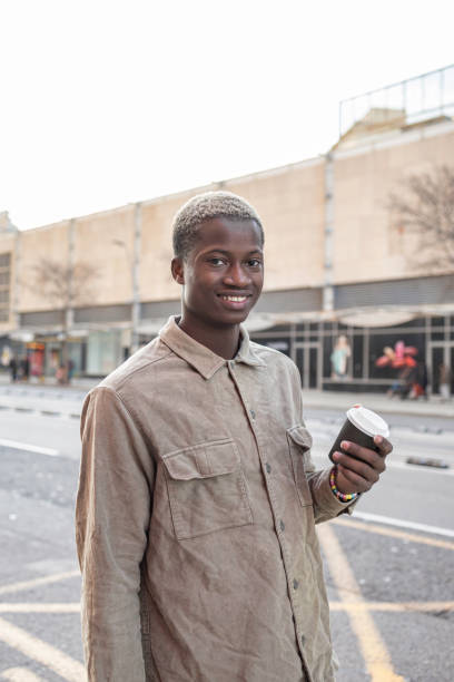 istock Portrait of a young black man with a coffee 1304521090