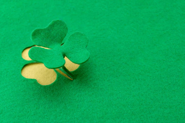Felt background for design to Saint Patrick's Day.Decorative clover leaf from green felt.St.Patrick's Day concept,copy space, top view.
