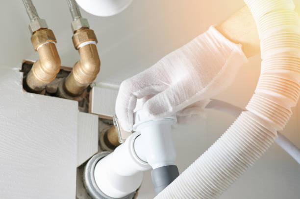 istock Plumber installing pipes in bathroom 1304524081