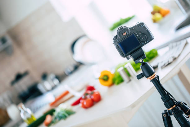 istock Blogging on the kitchen with a new recipe with the modern camera on a tripod 1304526123