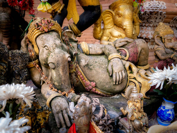 istock Old Ganesha Statue Lying with Another Ganesha Statues 1304526315