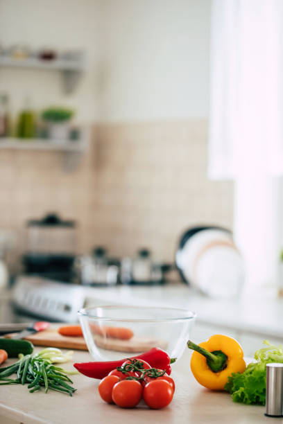 istock Ingredients for making a vegan fresh salad on the table against modern kitchen background 1304526590