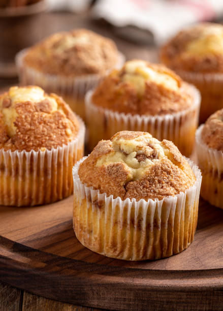 istock Cinnamon Muffins on a Wooden Platter 1304528524