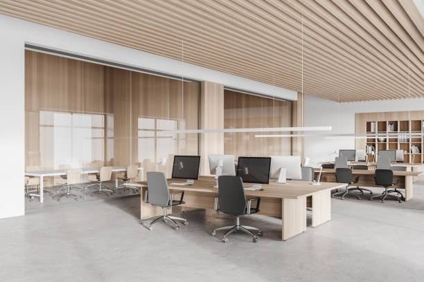 istock Wooden and white open space office corner 1304532357