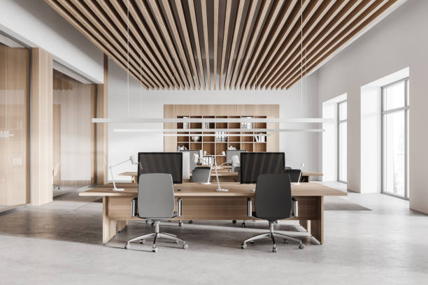 istock White and wooden open space office interior 1304532423