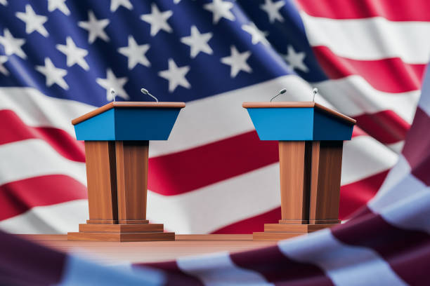 istock Two election debate tables over USA flag background 1304533057