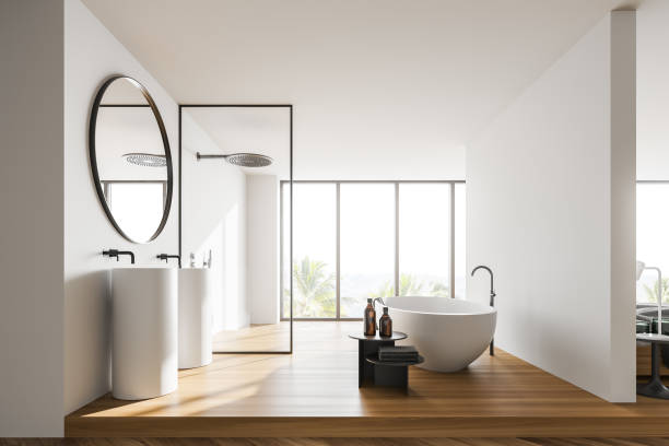 istock Modern white bathroom with sink and tub 1304534538