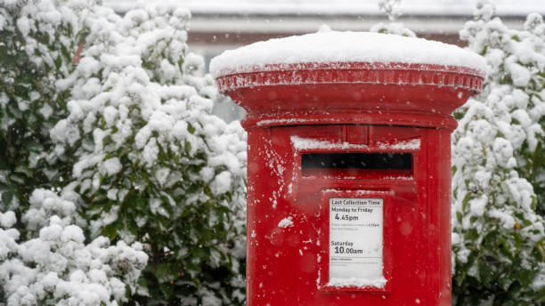 istock Red post box in the snow at Christmas 1304534804