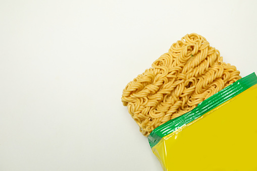 Package with instant noodles on white background