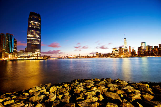Jersey City and New York at dawn over the Hudson river