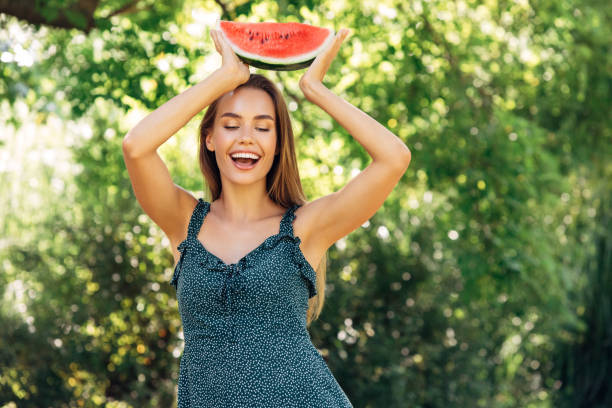 istock Enjoying sunny day wile eating watermelon 1304537358