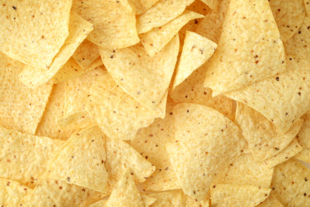 istock closeup background of nacho chips 1304538479