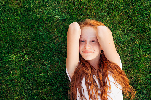 Pretty latin american blond girl at home looking at camera smiling very happy