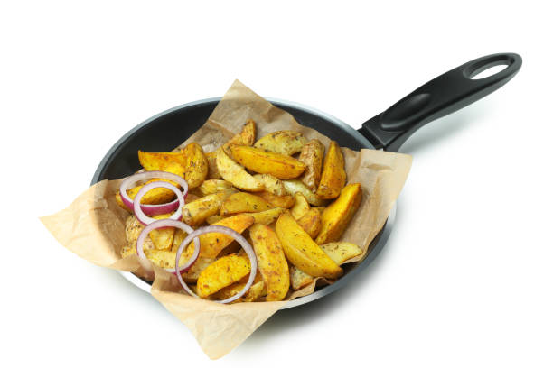 istock Pan with fried potato wedges isolated on white background 1304539053