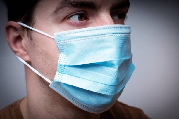 istock Man with a medical mask. 1304539844