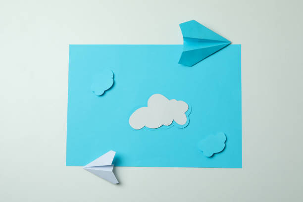 istock Travel concept with paper planes and clouds 1304540008