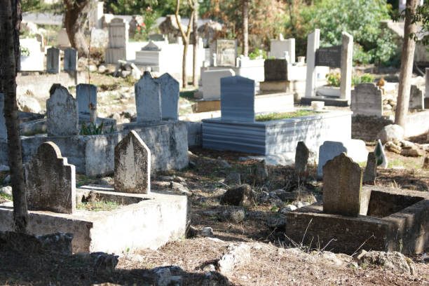 istock Tombstone and graves in an ancient Muslim graveyard. 1304540288