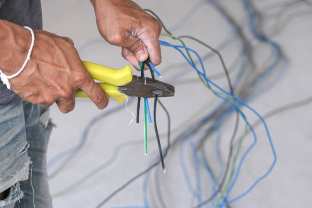 istock Electrician male working install wire power cable . professional technician worker cut wire electric cable by use cable cutters. 1304540295