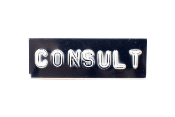 istock Embossed letter in word consult on black banner with white background 1304540355