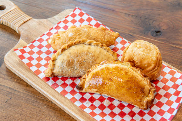istock Varied Argentine empanadas with different fillings on a wooden board 1304540471