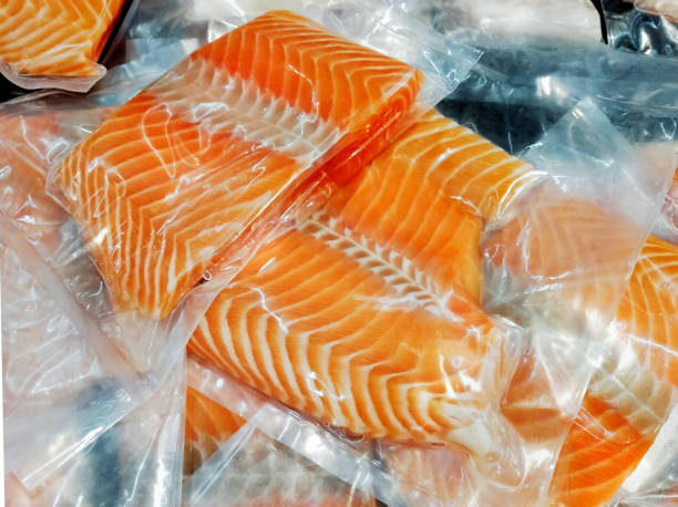 istock Frozen salmon fillet in plastic packing for sell. 1304540865