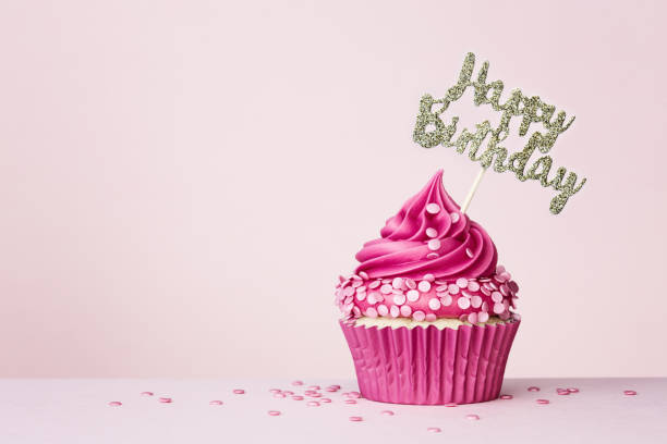 istock Birthday cupcake with happy birthday banner 1304542112