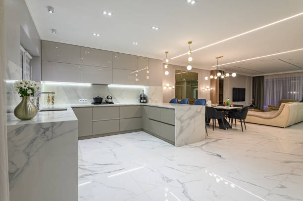 Luxury white modern marble kitchen in studio space Luxury large modern white marble kitchen united with dining room and living room marble floor dv studio types of flooring