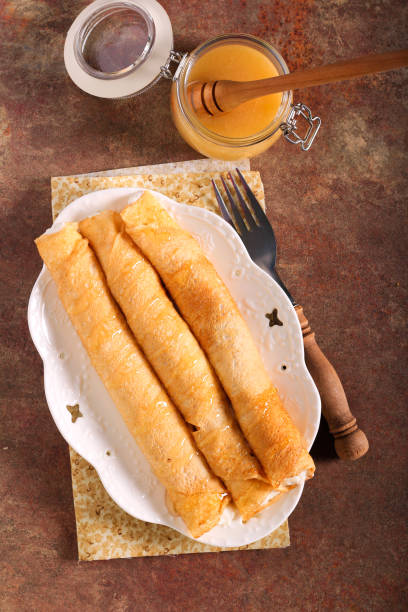 istock Ricotta and honey crepes rolls 1304544789