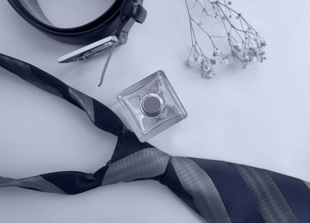 istock bottle of perfume, belt on colored background 1304547442