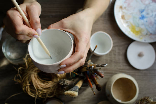 istock Hand-painting homemade ceramic dishes. 1304548857