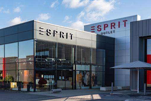 Mulheim-Karlich, Germany - February 27, 2021: Facade of the ESPRIT Outlet Store. Esprit is a manufacturer of clothing, footwear, accessories, jewellery and housewares