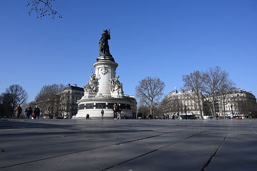 Paris, France - February 25, 2021: The monument in the middle of the large square symbolizes the victory of the Republic in France. The statue is dated 1833