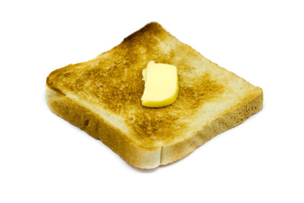 istock Toast bread with butter isolated on white background 1304551934