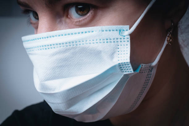 istock Woman with a medical mask. 1304552230