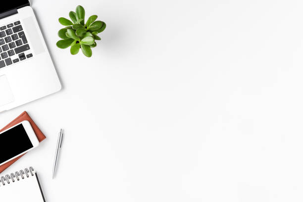 istock Minimalist office desktop with laptop and accessories. Business background with copyspace 1304552305