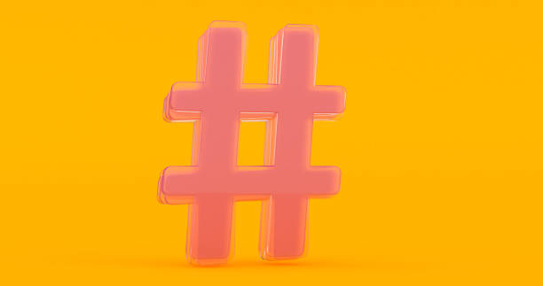 istock Volumetric glossy glass Hashtag icon isolated on orange background. 1304553392