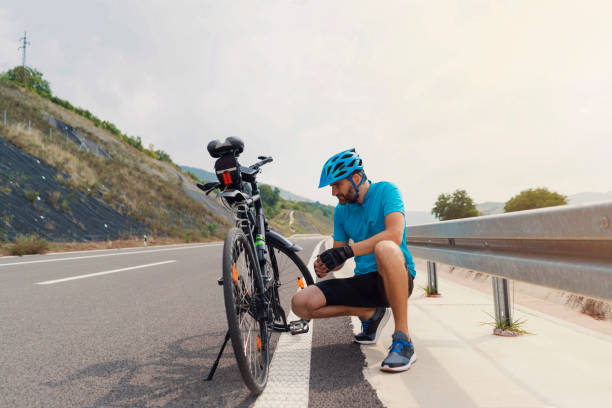 istock Man fixing a slipped bike chain 1304555264