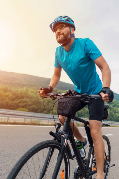 istock Man riding a bicycle on the open road 1304555280