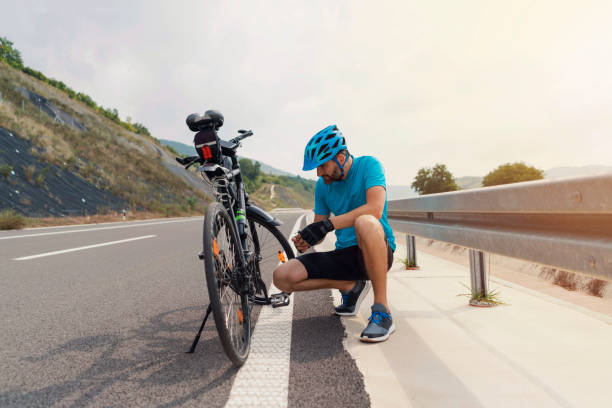 istock Man repairing his bicycle 1304555291