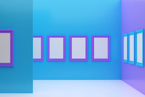 Picture frames on blue and purple colors wall.