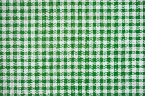 Happy St. Patrick's day. Gingham pattern in green and white, closed up texture of green and white for background. Picnic table cloth.