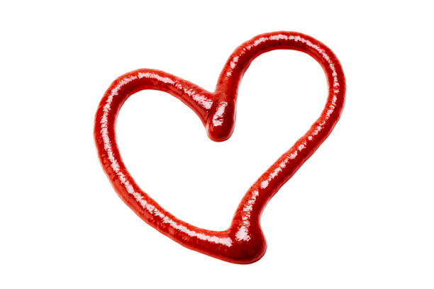 istock ketchup sauce isolated on white background. tomato sauce cut out. design element. studio shot. heart symbol 1304557492