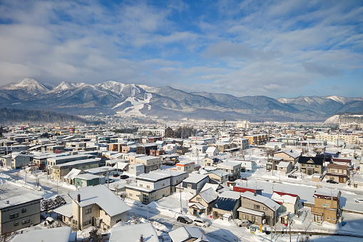 Winter vista of Furano, Hokkaido, Japan\nFurano Ski Resort can be seen.