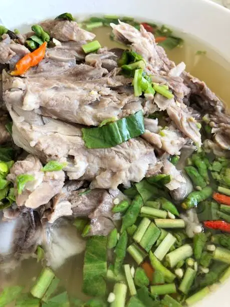 Photo of Giant dish of Thai style food. Hot and Spicy Soup with Pork Ribs. Spicy Pork with Pork bone Soup (Lang Zaap). Is a spicy and popular food in Thailand Tourists like it very much.