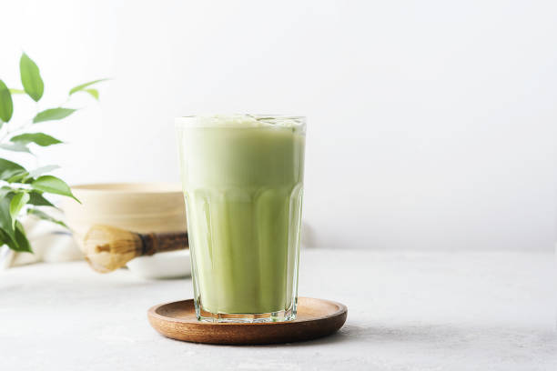 istock A glass of matcha tea on a concrete background with  copy space. 1304560784
