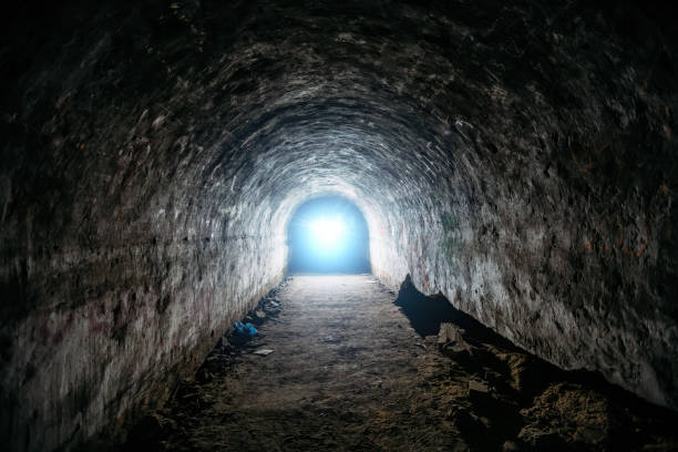 istock Tunnel with concrete walls in old abandoned Soviet bunker 1304563474