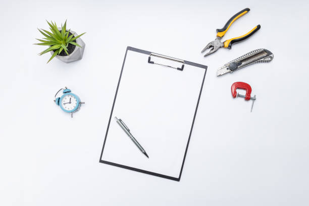 istock construction planning work concept. above view. blank clipboard, wooden planks and tools on table. handyman checklist conceptual 1304563731